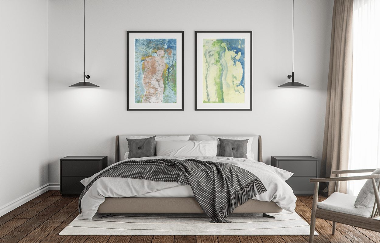 Two framed Monica Cohn works above a bed
