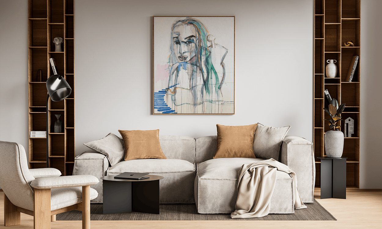 A Monica Cohn portrait drawing above a sofa
